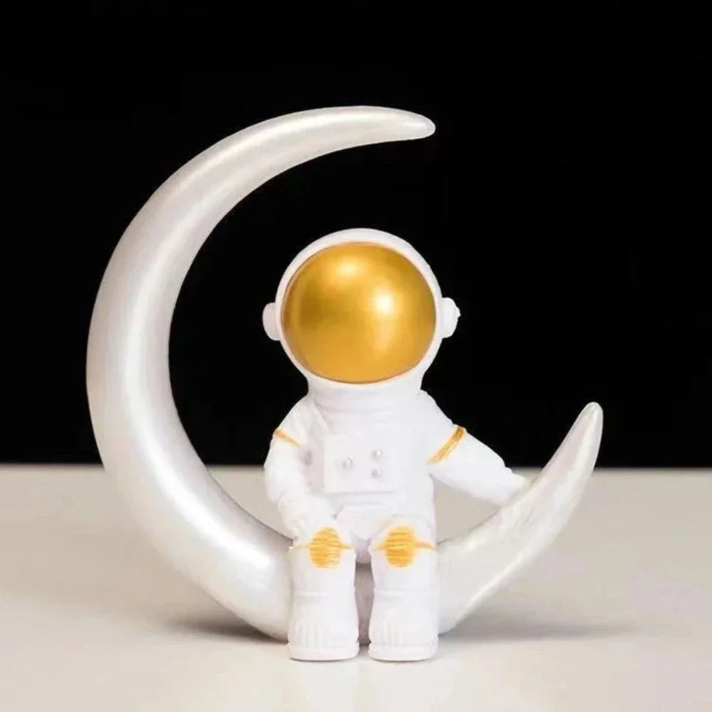 4 figurines d'astronautes